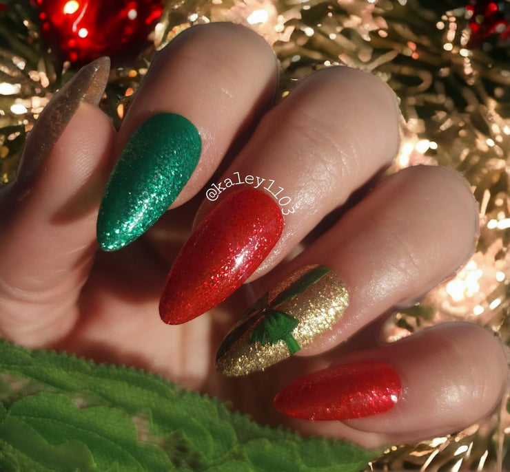 It’s Christmas is a red, platinum, glitter gel polish